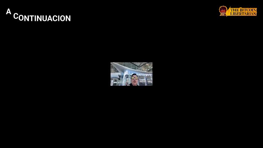 The image shows a person's face displayed on a computer screen, with the text "A continucion" above them. The background of the image is black, making the person's face stand out prominently. There are no other objects or texts in the image besides the person and the caption.