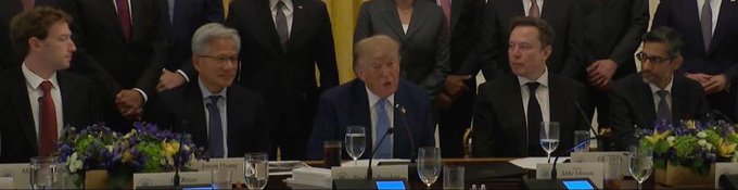 The image shows a panel of men in suits seated at a formal meeting, with nameplates visible for "Jensen Huang" and what appears to be other executives, including Elon Musk, with a caption suggesting the "combo" of these tech leaders working together proved beneficial to the poster.
