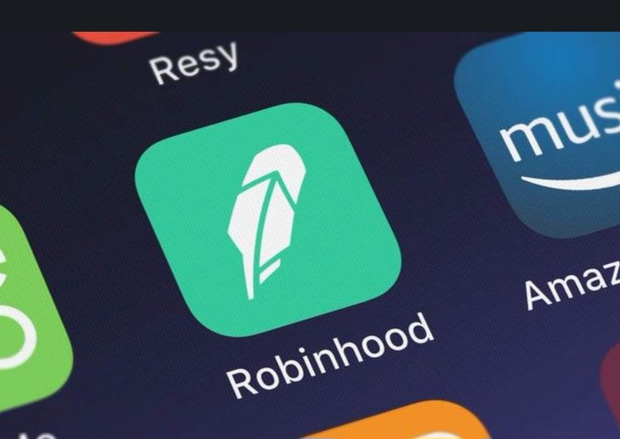 A close-up photo of a smartphone screen showing the green Robinhood app icon alongside Resy, Amazon Music, and other apps.