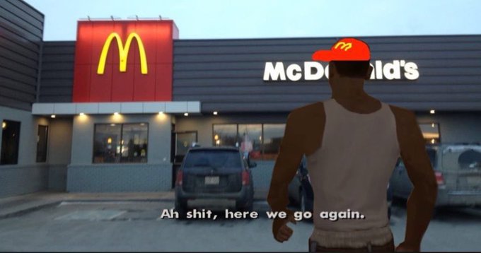 A screenshot from a video game shows a character wearing a McDonald's cap walking toward a McDonald's restaurant, with the caption 'Ah shit, here we go again.'