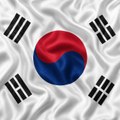 The image shows the flag of South Korea, featuring its iconic red and blue taegeuk symbol in the center surrounded by four black trigrams on a white background, representing the country referenced in the post about South Korea's plan to bring stocks, bonds, and funds on-chain.