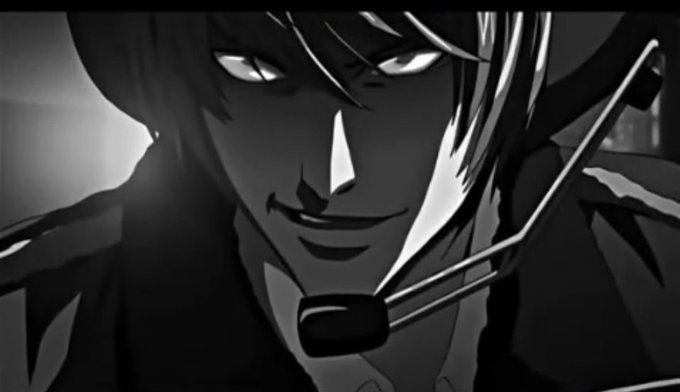 A black and white anime-style close-up of a character with dark hair and glowing eyes, displaying a sinister grin.