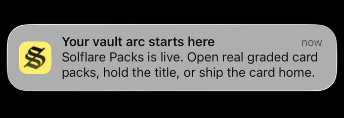 An image featuring a gray box with black text in an open, cursive font. The main text reads: "Your vault arc starts here. Solflare Packs is live. Open real graded card . . ."