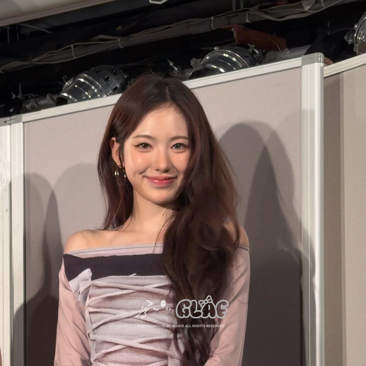 A young woman with long brown hair smiles at the camera, wearing a pink off-shoulder dress, with a watermark reading 'GLAF' and 'COPYRIGHT©GLAF Sui410 ALL RIGHTS RESERVED'.