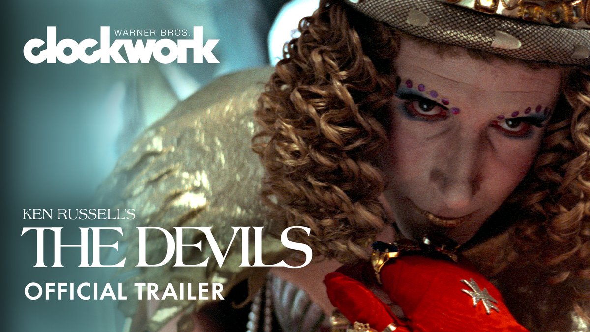 Promotional image for the Warner Bros. Clockwork release of 'The Devils' by Ken Russell, featuring a character with elaborate eye makeup and an ornate red and gold costume.