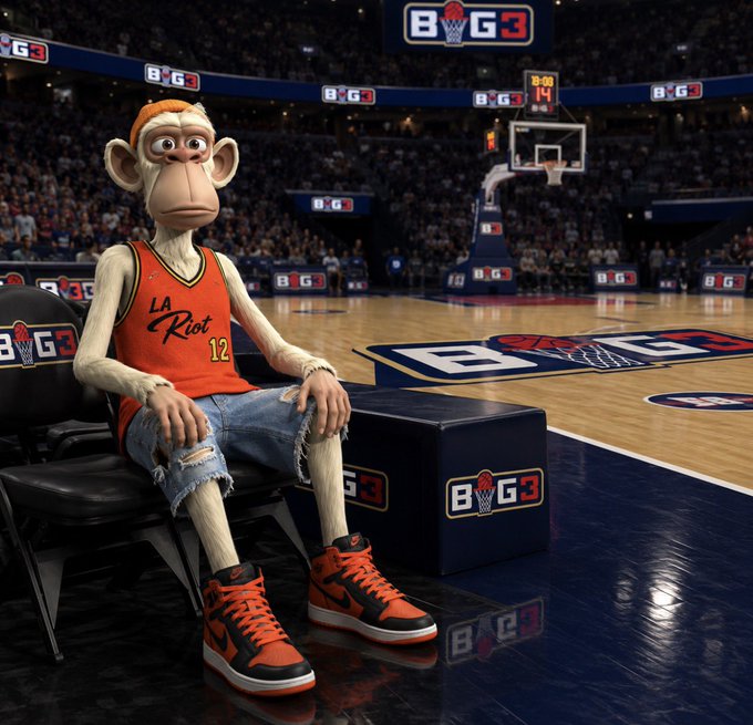 A 3D rendered monkey character wearing an orange 'LA Riot #12' basketball jersey, ripped denim shorts, and orange sneakers sits on a chair at a BIG3 basketball court.