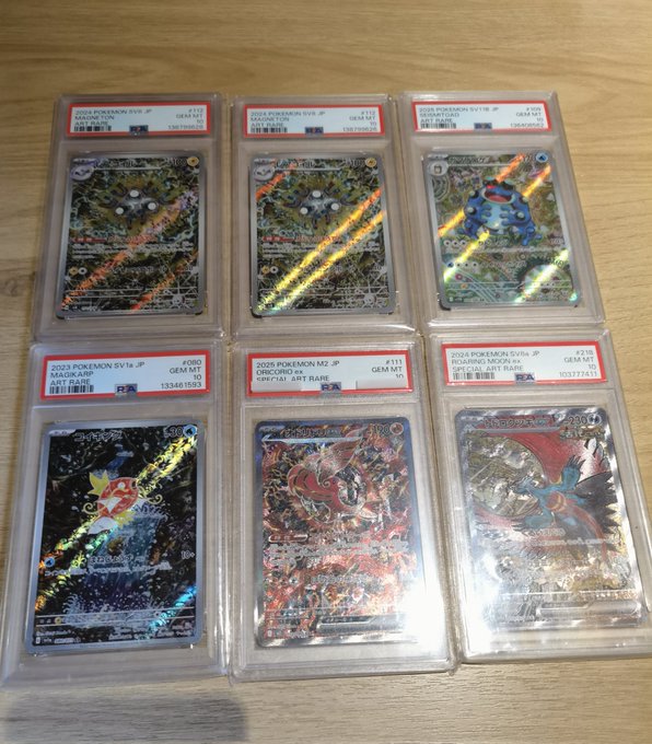 A collection of six Pokemon cards are displayed on a wooden surface, including two that have foil-like coverings with unique colors. The cards appear to be valuable collectibles from a few years ago. A caption below this image mentions an older batch of cards being sold for under $10 and possibly even older than what is currently popular among collectors.