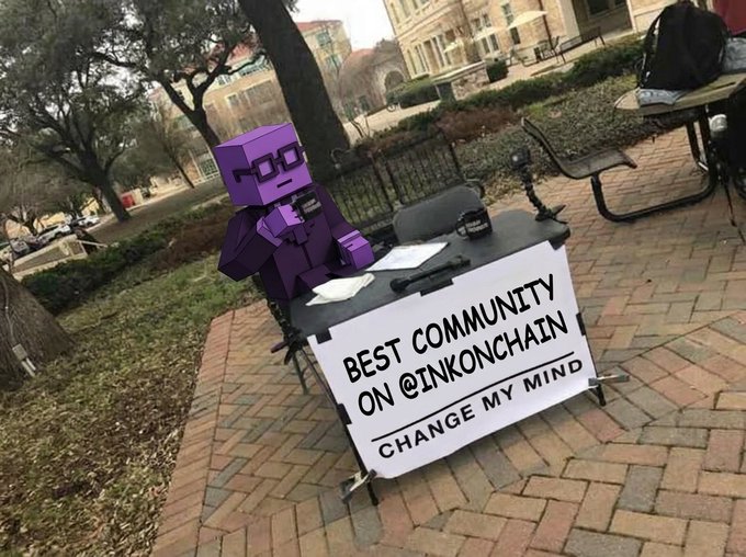 A purple cartoon character wearing glasses sits at an outdoor table displaying a sign that reads "BEST COMMUNITY ON @INKONCHAIN" with "CHANGE MY MIND" underneath, visually reinforcing the post's challenge to debate InkOnChain's community quality.
