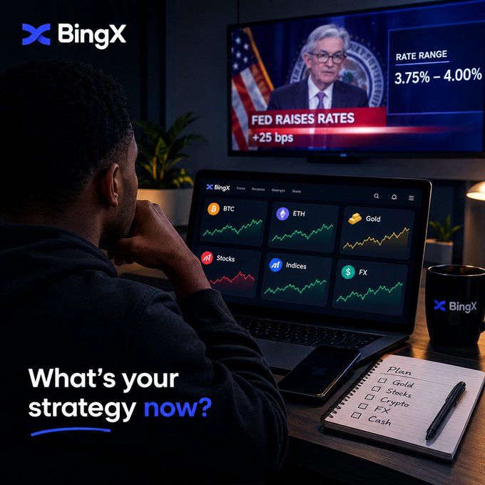 A BingX advertisement showing a man watching a TV report about the Fed raising rates by +25 bps to a 3.75%-4.00% range, with a laptop displaying BTC, ETH, Gold, Stocks, Indices, and FX charts, and text asking "What's your strategy now?"