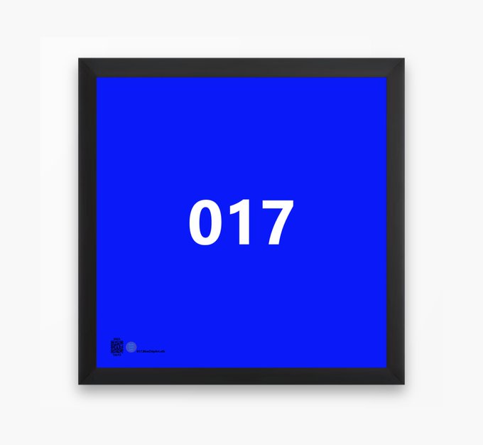 A black framed picture displays a blue square background with the white number '017' in the center.
