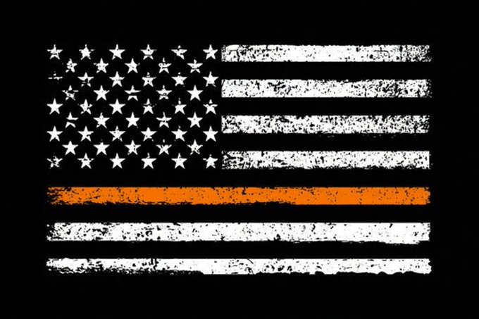A distressed American flag with a prominent orange "Thin Line" stripe, symbolizing support for search and rescue personnel, is displayed against a black background. The weathered, grunge-style design emphasizes a sense of urgency and solidarity with emergency responders.