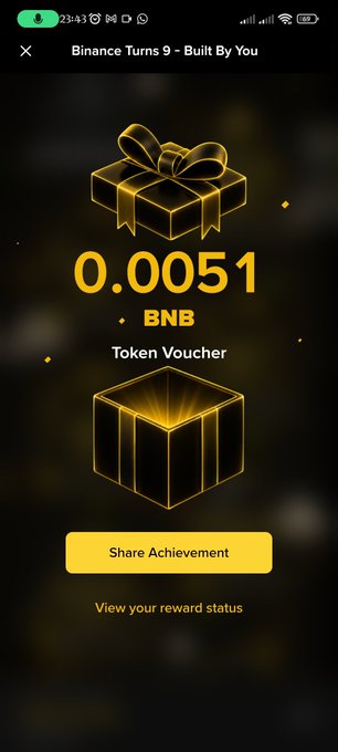 A screenshot of a mobile app titled 'Binance Turns 9 - Built By You' showing a reward of '0.0051 BNB Token Voucher' with a 'Share Achievement' button.