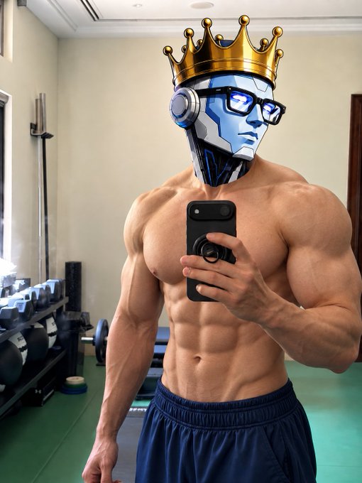 A muscular shirtless man wearing blue shorts takes a mirror selfie in a gym, featuring a digitally-added crowned robot head with headphones and glasses. The image humorously contradicts the post's claim of "no AI, no photoshop" by visibly incorporating AI-generated robotic elements onto his otherwise natural physique.