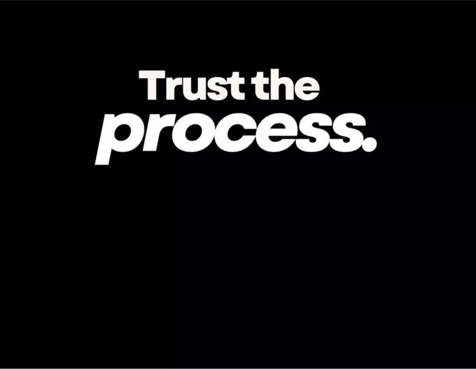 A black background with the white text 'Trust the process.' displayed in a bold, modern font.
