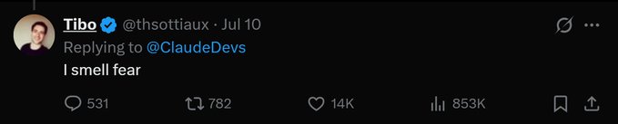 A screenshot of a tweet from Tibo (@thsottiaux) replying to @ClaudeDevs, reading "I smell fear," with 531 replies, 782 retweets, 14K likes, and 853K views, humorously capturing the anxiety and competitive tension among AI labs after the rapid release of a new model.