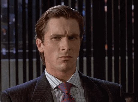 A reaction GIF of actor Jim Carrey (as Fletcher Reed from Liar Liar) with a skeptical, side-eye facial expression.