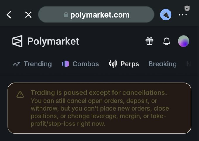 A screenshot of the Polymarket.com website showing a warning message: 'Trading is paused except for cancellations. You can still cancel open orders, deposit, or withdraw, but you can't place new orders, close positions, or change leverage, margin, or take-profit/stop-loss right now.'