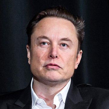 The image shows a man with dark hair in a black suit and white shirt against a dark background. The post relates as it discusses Elon Musk's announcement about Grok's new capabilities with the Imagine tool, and the man pictured is Elon Musk, the CEO associated with the platform making this announcement.
