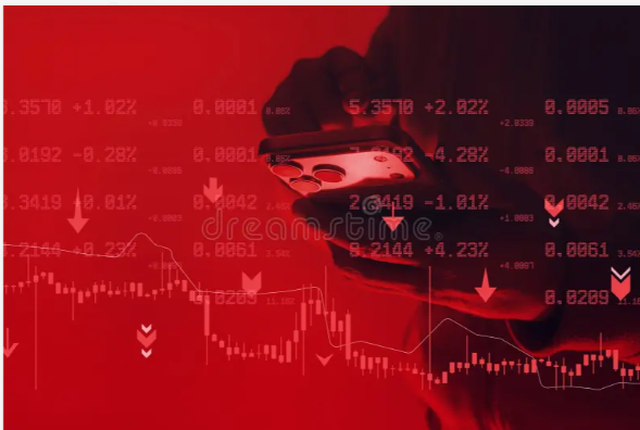 A conceptual image with a red color overlay showing a hand holding a smartphone against a backdrop of stock market charts, downward arrows, and percentage changes indicating a market decline.