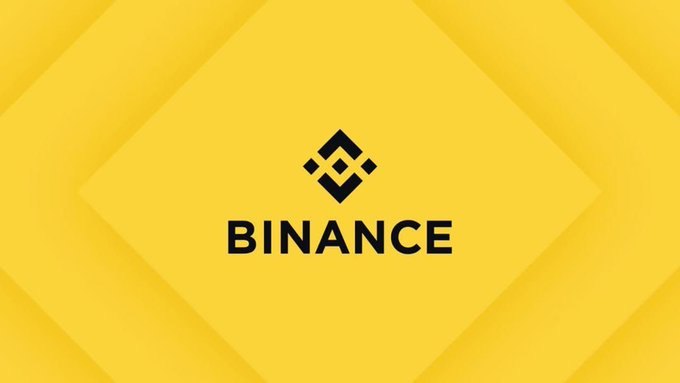 The Binance logo, featuring its geometric symbol and name, is displayed in black text against a bright yellow background with diamond patterns.