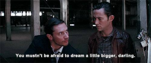 Two men in a dimly lit industrial space share an intimate moment, with the caption reading "You mustn't be afraid to dream a little bigger, darling." The image's message about dreaming bigger aligns with the post's call for Ethereum enthusiasts to honestly evaluate Monad's technology, suggesting that embracing new possibilities beyond current limitations is essential for intellectual integrity.