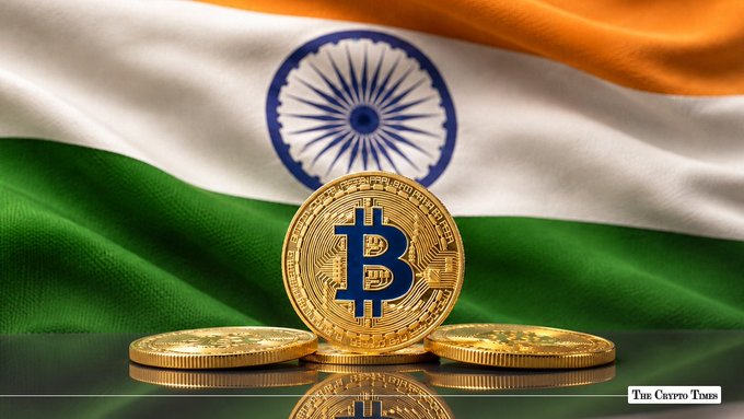 The image features three gold Bitcoin coins displayed in front of India's flag, with the central coin prominently showing the "₿" symbol. The accompanying text discusses India's pilot of tokenized government bonds settled in digital rupees, highlighting the country's experimentation with central bank digital currency in formal financial markets rather than everyday transactions.