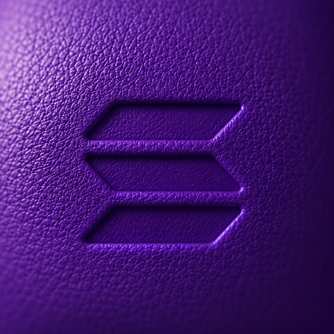 The image features a close-up view of a purple leather surface with a logo that reads "solana". This logo, which is located at the center of the image, stands out against the dark purple background. The text "solana" is clearly visible and appears to be in a larger font size than the rest of the image. The positioning of the logo on the leather surface suggests it might be related to the cryptocurrency or blockchain technology known as solana.