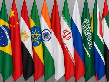 A display of various national flags, including those of Brazil, China, Egypt, Ethiopia, India, Iran, Russia, Saudi Arabia, and Sudan.