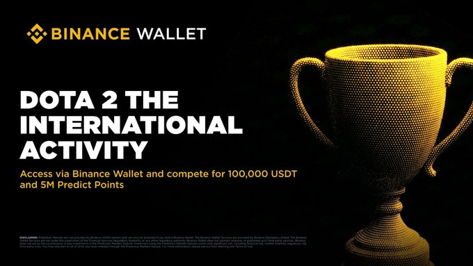 A promotional banner for 'BINANCE WALLET' advertises a 'DOTA 2 THE INTERNATIONAL ACTIVITY' with a golden trophy, offering access via Binance Wallet to compete for '100,000 USDT and 5M Predict Points'.