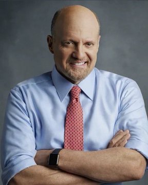 A confident, smiling middle-aged man with a goatee, wearing a light blue dress shirt and red patterned tie, poses with crossed arms against a dark backdrop. The post celebrates Jim Cramer's notoriously wrong Bitcoin call, humorously noting BTC has surged over 30% after he claimed to have sold all of his holdings.
