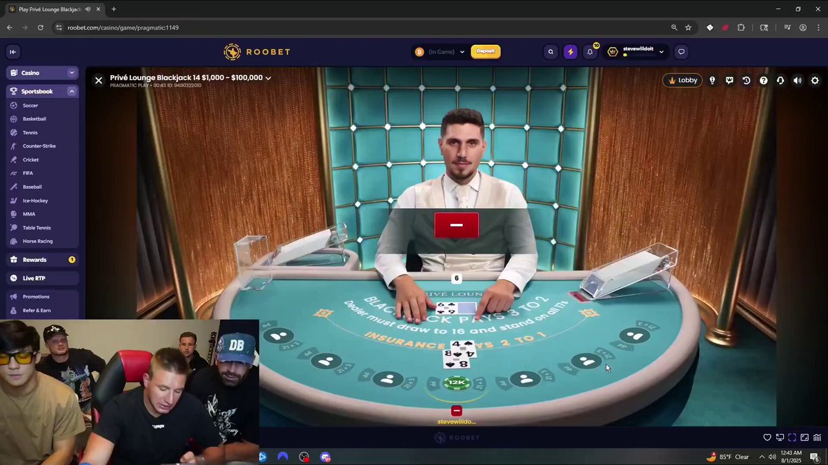 The image shows a group of people playing a video game, specifically a card game like poker or blackjack. There are at least five players visible in the scene, with one person sitting at a table holding a deck of cards while others watch intently. The players appear to be engaged and focused on their gameplay. 

The image also contains text that reads "Steve & Togi running it up playing BJ on @Roobet". This suggests that Steve and Togi are the main players in this game, and they might be discussing strategies or sharing tips with each other during the game. The presence of a deck of cards indicates that the game is likely card-based, which is typical for poker or blackjack games.