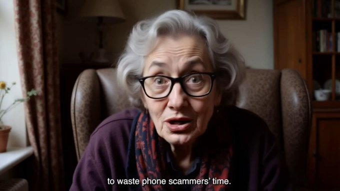 An elderly woman with glasses and gray hair, sitting in a brown leather armchair with a floral curtain and bookshelf in the background, stares wide-eyed at the camera with the subtitle "to waste phone scammers' time."

The image humorously pairs with the post about Apate's AI bots scam-baiting fraudsters, as the woman's exasperated expression mirrors the frustration the company aims to inflict on scammers.