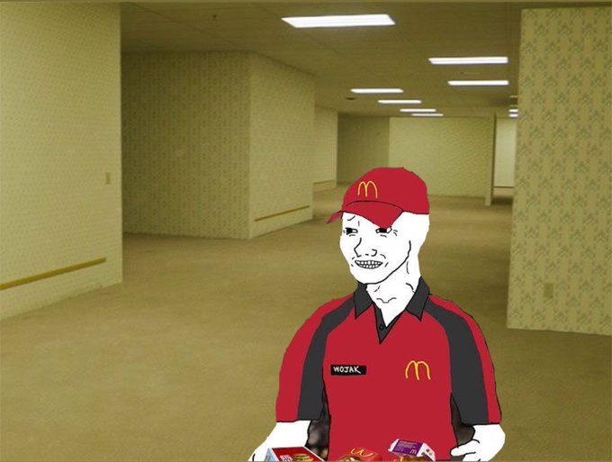 The image features a cartoon-like illustration of a McDonald's employee, wearing a red shirt with black lettering, standing in an empty hallway with a cardboard box containing food items in front of him. The caption provided for this image reads "About to go watch the new backrooms movie". This may be a reference to the character named WOJAK from the movie series "Backwards".