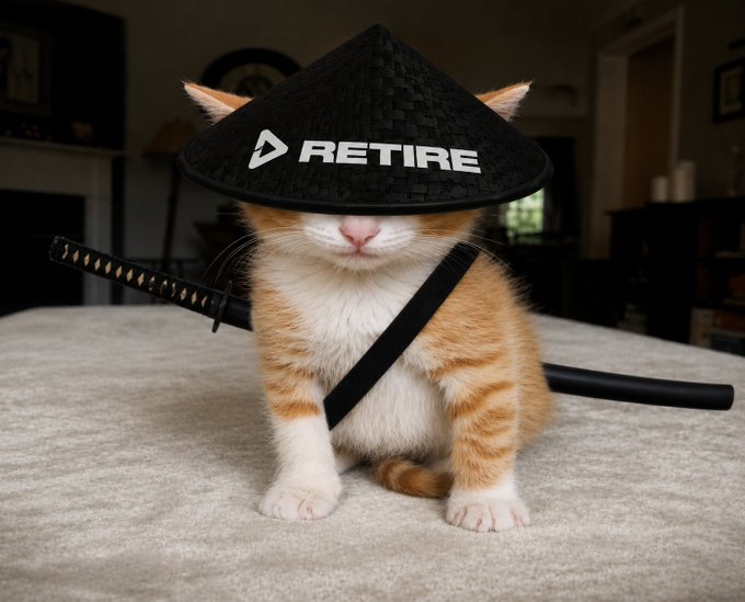 An orange and white kitten sitting on a bed wearing a black samurai straw hat with the text 'RETIRE', accompanied by a sheathed katana slung across its body.