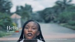 A video thumbnail featuring a woman speaking on camera with the text 'Hello World' overlaid.