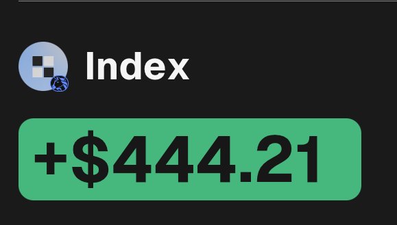 A dark screen displays an 'Index' logo with a pixelated face icon, alongside a green banner showing a positive value of '+$444.21'.