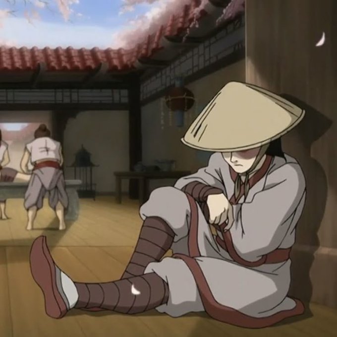 An anime-style illustration of a character wearing a conical straw hat and gray robes sitting on a wooden porch, sharpening a small blade while people wash clothes in the background.