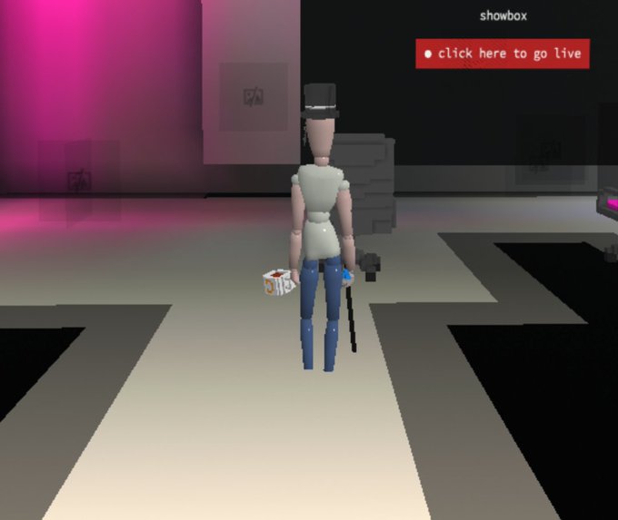Low-poly 3D game screenshot showing a character from behind in a white shirt and blue jeans holding items, with a 'click here to go live' button and 'showbox' label.