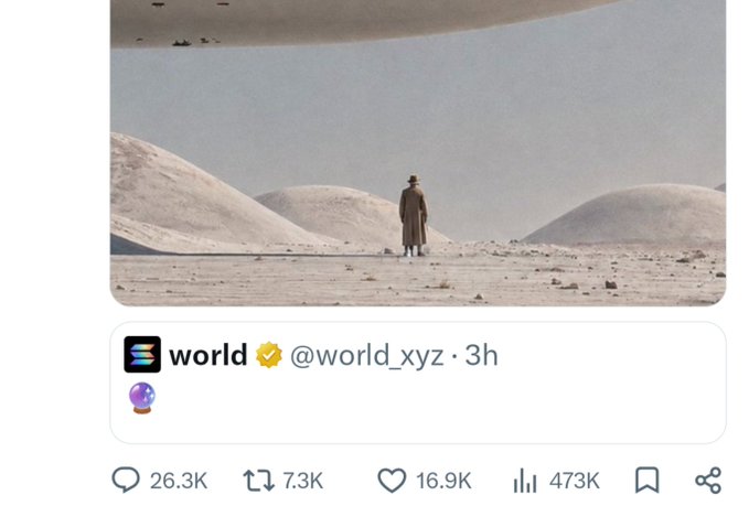 A screenshot of a post from 'world @world_xyz' featuring an image of a lone figure in a desert landscape with strange floating orbs in the sky, gaining 473K views.