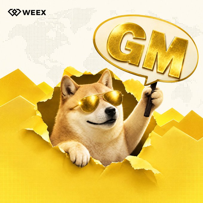 A Shiba Inu dog wearing gold sunglasses holds a 'GM' sign while peeking through torn yellow paper, branded with the WEEX logo.