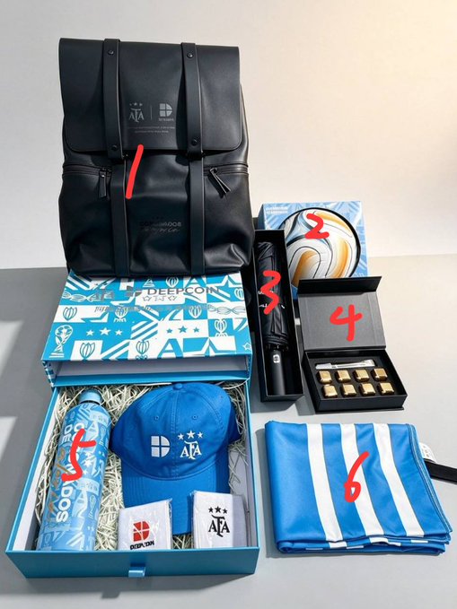 A promotional giveaway display featuring Argentina football-themed merchandise, including a black backpack (1), a soccer ball in a blue "Deepcoin" box (2), a black tube accessory (3), a black gift box with chocolates (4), a cap, tumbler, and keychain inside a patterned box (5), and a folded blue and white striped scarf (6), all branded with AFA and Deepcoin logos to promote a contest by official partner @deepcoin_cn for Blue-White Legion fans.