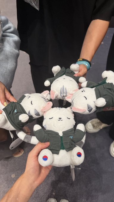 A group of friends holds up matching gray-green hooded rabbit plushies arranged in a circle, paws meeting in the center. The post references Hyperliquid and $HYPE, with the cute mascots serving as a playful visual celebrating the crypto token.