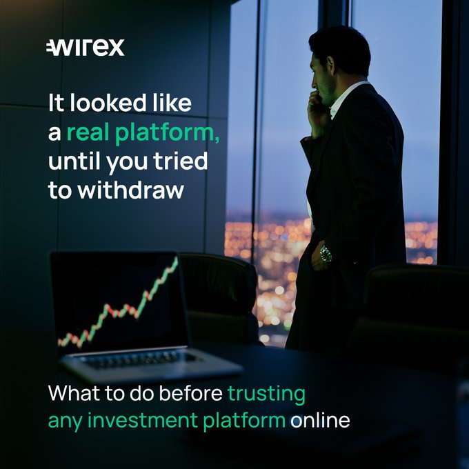 A man in a suit stands by a window overlooking a cityscape at night while on his phone, with a laptop displaying an upward-trending stock chart on the desk beside him. The image features the "Wirex" logo and text reading "It looked like a real platform, until you tried to withdraw" and "What to do before trusting any investment platform online," illustrating the post's warning about fake trading platforms that mimic legitimate brokers to deceive investors.