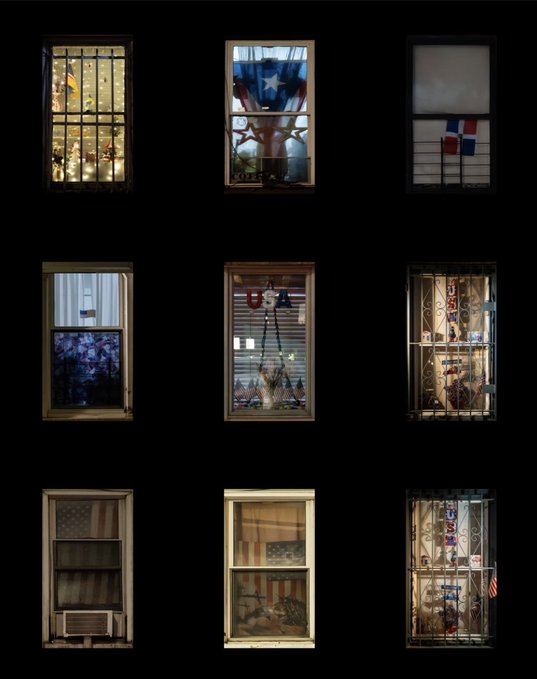 A 3x3 grid photograph of apartment building windows at night, displaying various decorations including American flags, Dominican Republic flags, and patriotic USA bunting.