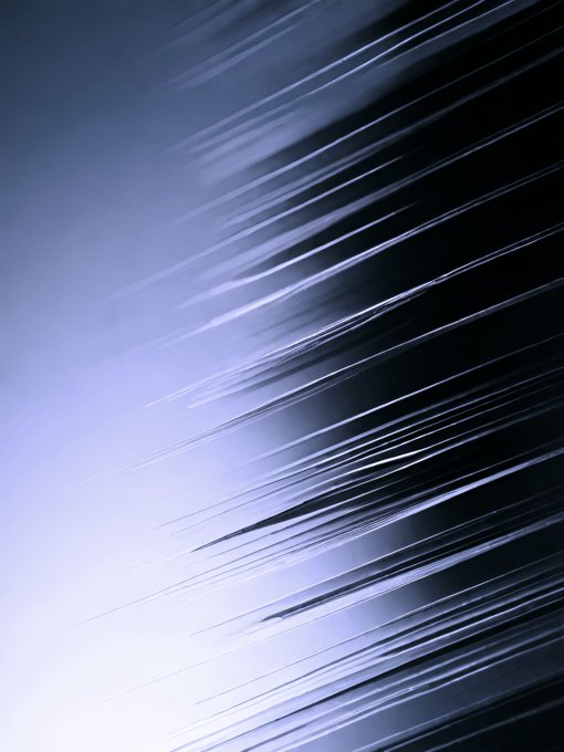 An abstract digital image displays a gradient of light purple and dark blue, with sharp, radiating white lines bursting from the center-left.