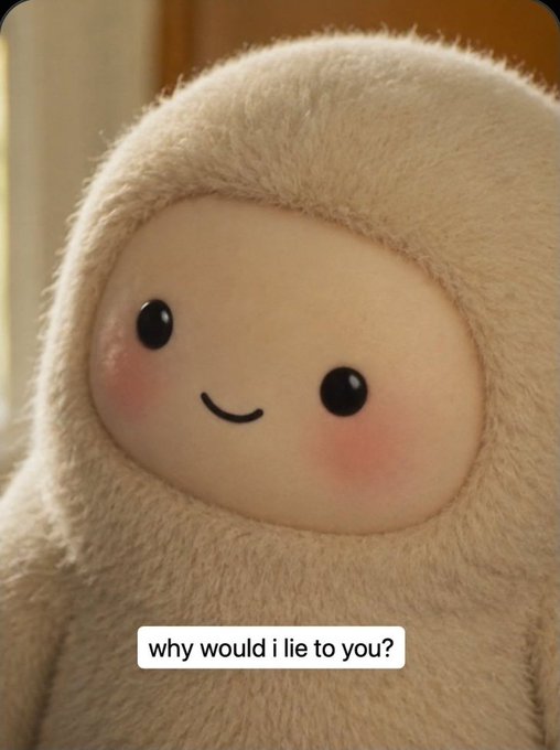 A close-up of a fluffy, cream-colored plush toy with a simple smiling face and rosy cheeks, with the caption "why would i lie to you?" at the bottom.