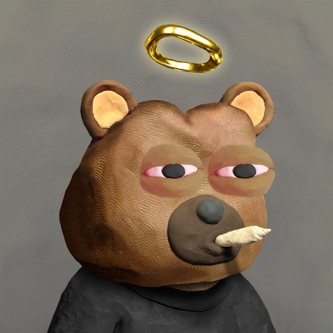 A 3D-rendered brown bear character with droopy pink eyes, a golden halo floating above its head, and a small tusk protruding from its mouth, wearing a dark shirt.