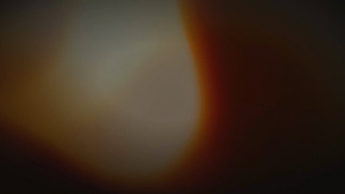 A soft, blurred gradient of warm orange, brown, and cream tones fills the frame, evoking an abstract, ambient mood. The lack of discernible subjects, text, or logos leaves the image as a vague, atmospheric backdrop that loosely complements the post's announcement about private USDC features on Starknet.