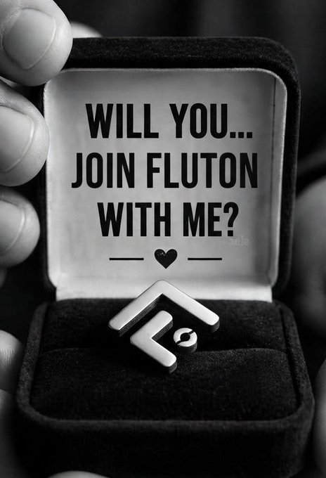 A black-and-white photo of a hand holding an open ring box containing a Fluton-branded ring, with the text 'WILL YOU... JOIN FLUTON WITH ME?' printed inside the lid.
