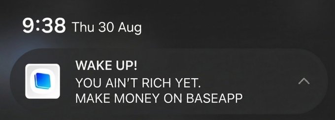 A mobile phone notification at 9:38 on Thursday, August 30, reading 'WAKE UP! YOU AIN'T RICH YET. MAKE MONEY ON BASEAPP'.